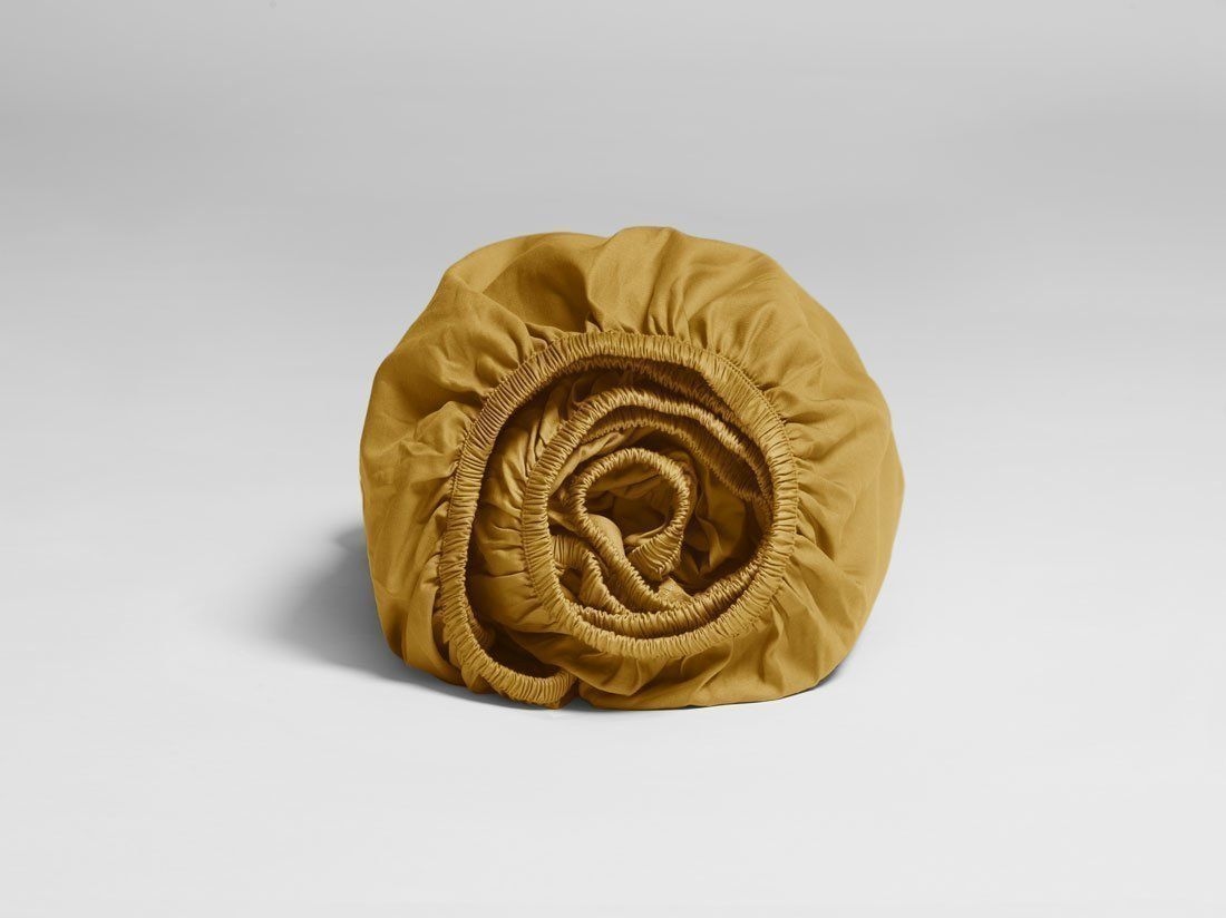 Faconlagen bomuldssatin classic gold